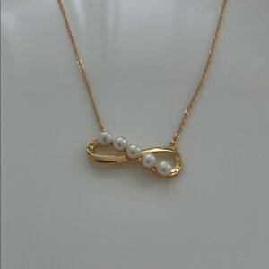 Elegant Gold Pearl Infinity Necklace